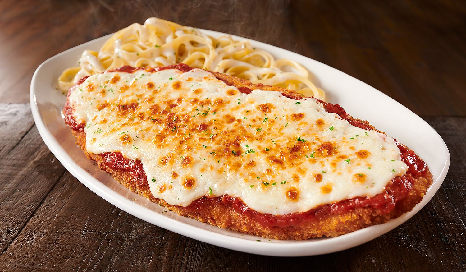 Olive Garden Is Bringing Back Its Giant Chicken Parm And It's Almost A